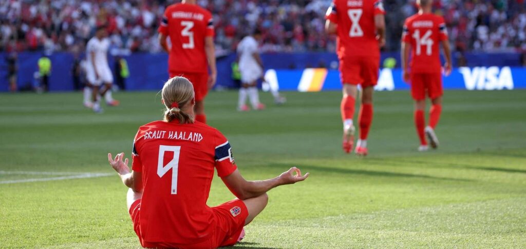 Erling Haaland with his typical celebration after scoring against Iraq