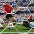 Iran goalkeeper stops the ball just before the goal line in the match against Belgium