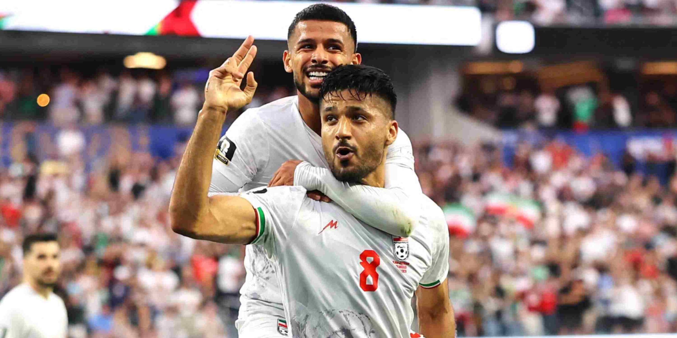 Iranian players celebrate after scoring against New Zealand