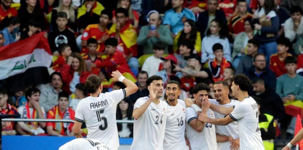 Iraq players celebrate after equalizing against Spain