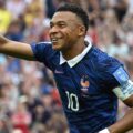 Kylian Mbappe celebrates after scoring against Iraq