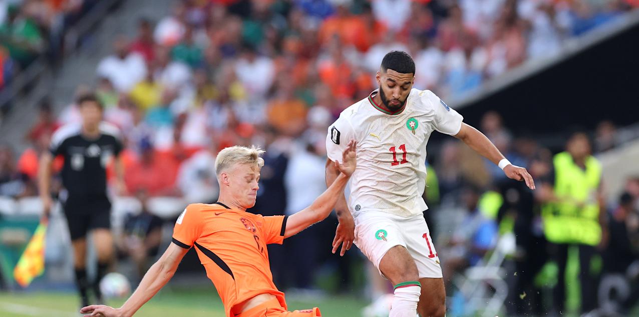 Netherlands and Morocco players in a battle for the ball