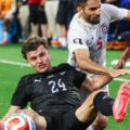 New Zealand and Iran players in a battle for the ball