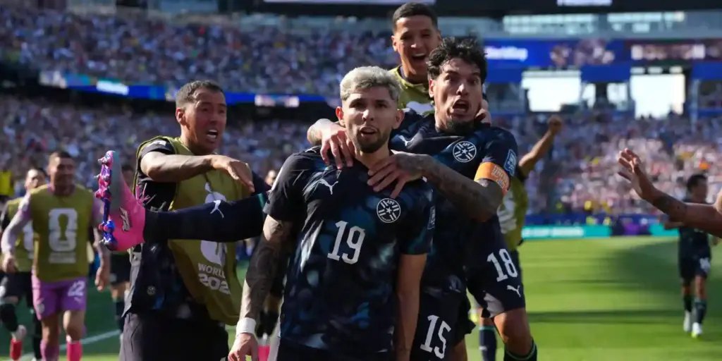 Paraguay players celebrate after scoring against Germany