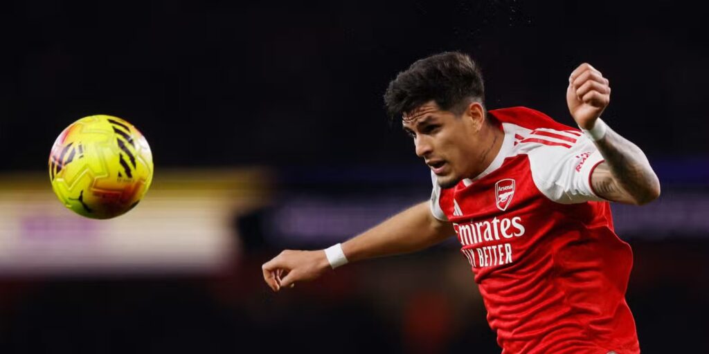 Arsenal defender Piero Hinkapie heading the ball