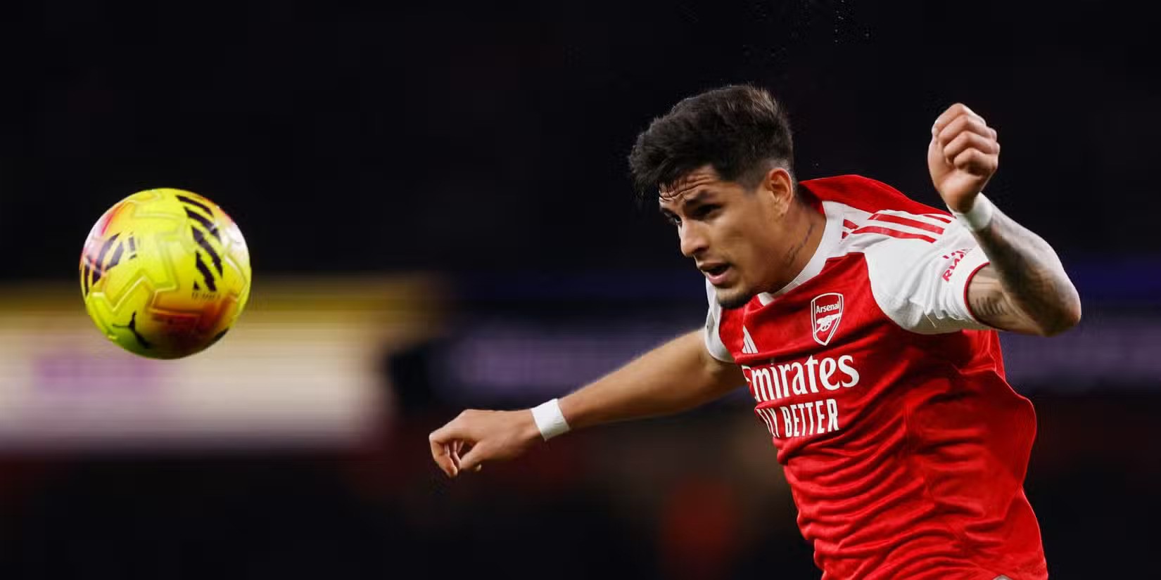 Arsenal defender Piero Hinkapie heading the ball