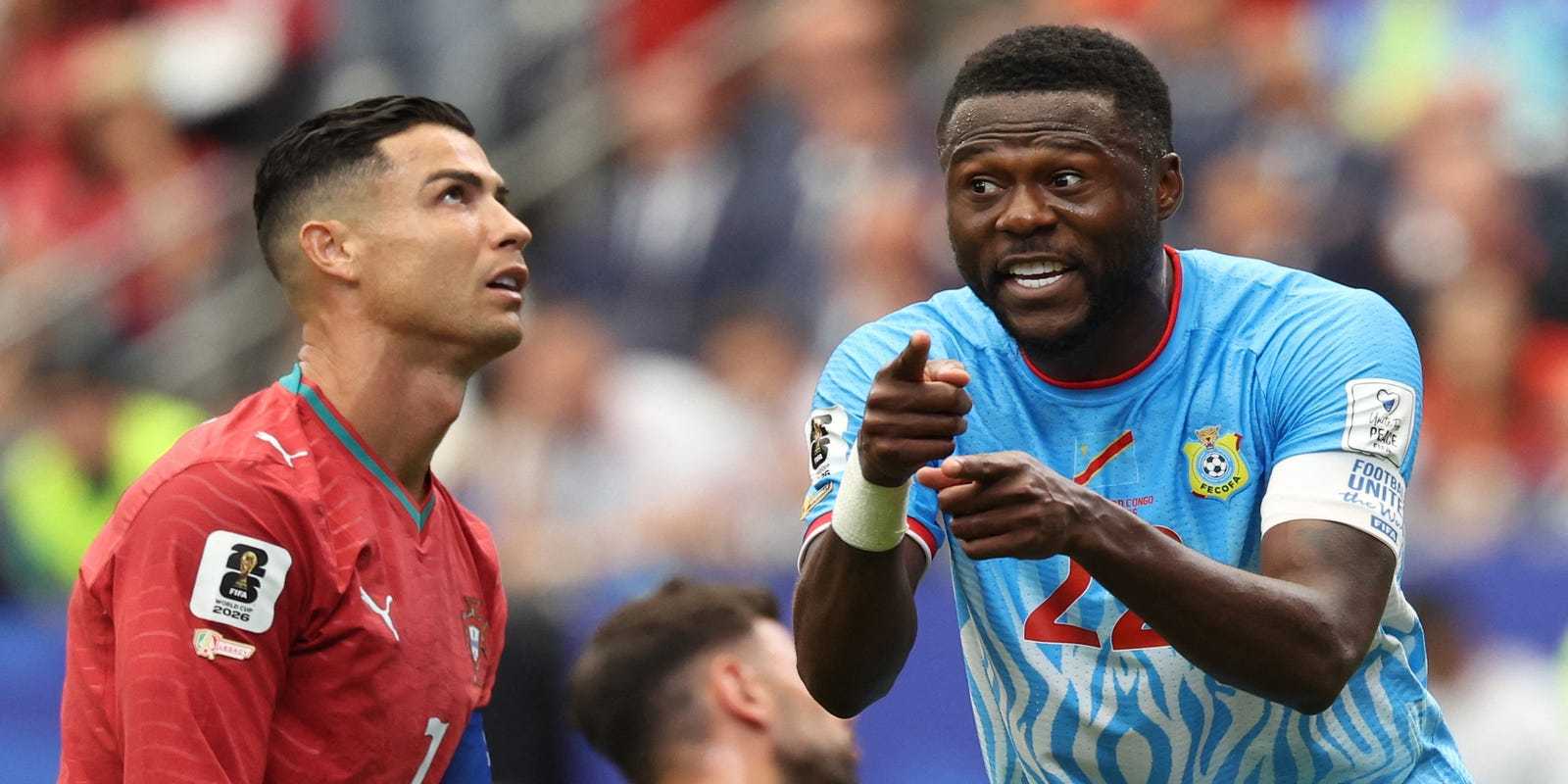 Cristiano Ronaldo looking at the sky as Congo player gives instructions to teammates