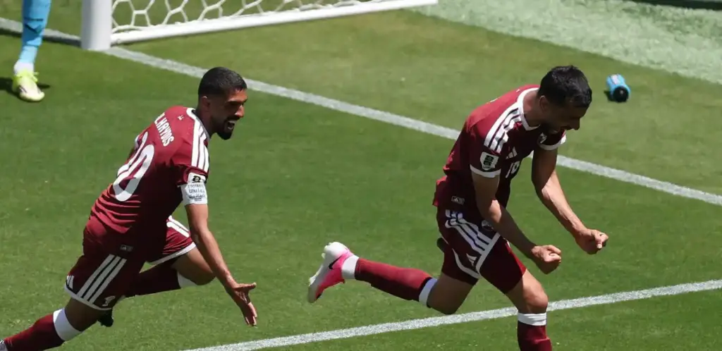 Qatar players celebrate after equalising in stoppage time against Switzerland