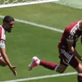 Qatar players celebrate after equalising in stoppage time against Switzerland