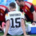 Nico Schlotterbeck receiving treatment for an injury during the World Cup