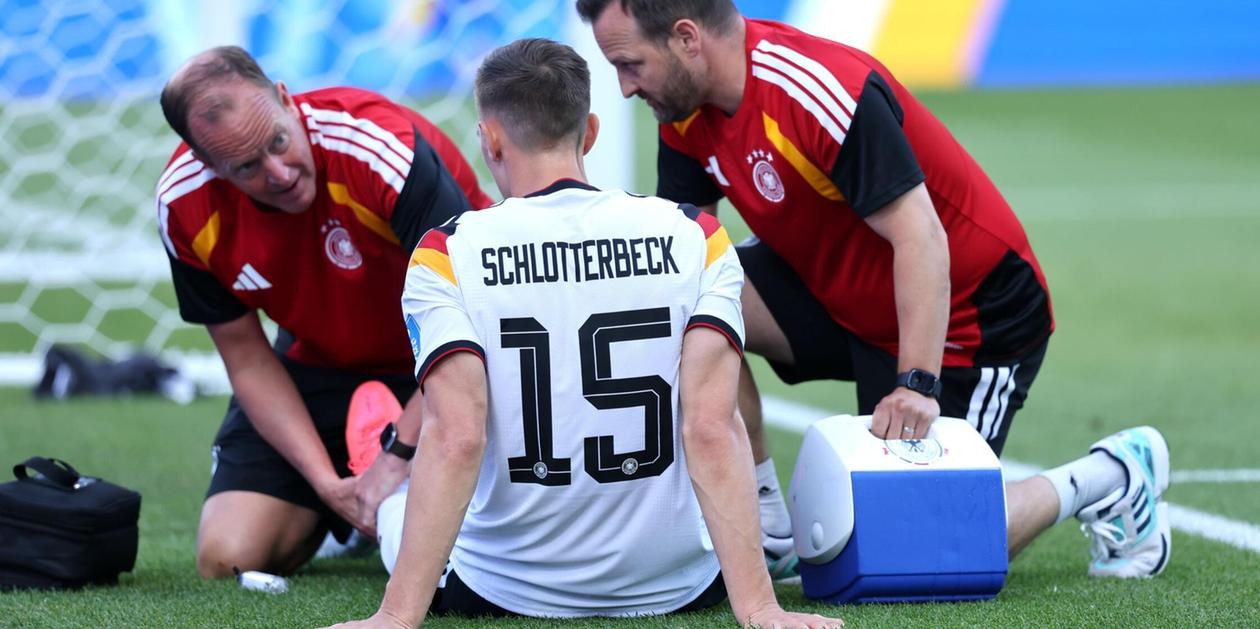 Nico Schlotterbeck receiving treatment for an injury during the World Cup
