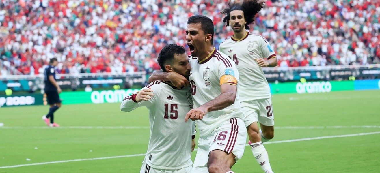 Spain players celebrate after scoring against Uruguay