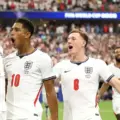 England players congratulating Harry Kane after his goal against Croatia