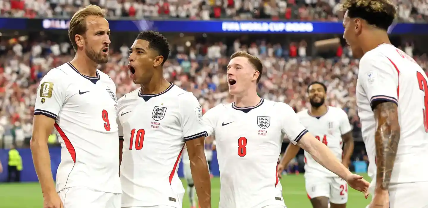 England players congratulating Harry Kane after his goal against Croatia