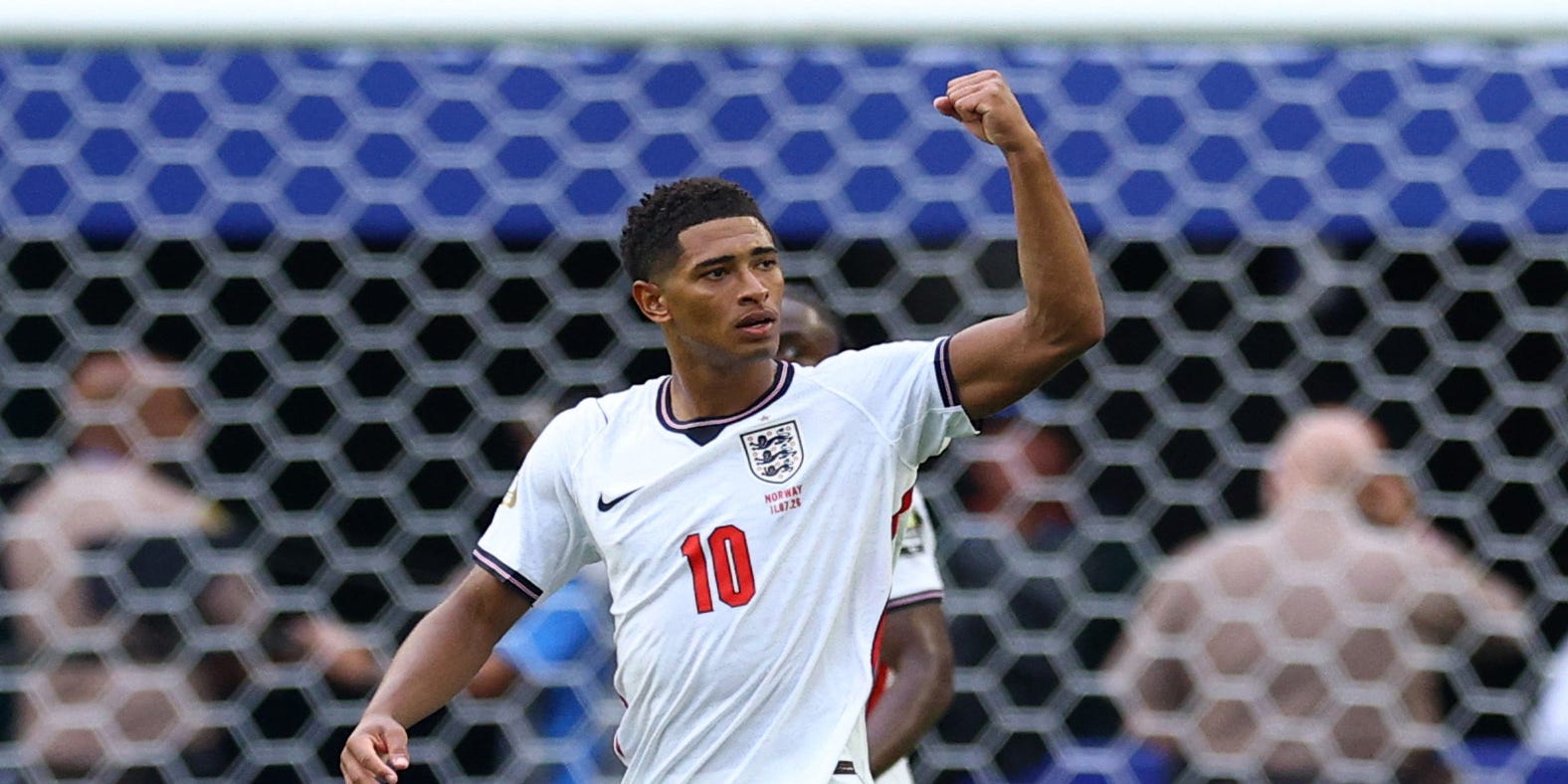 Jude Bellingham punches the air after scoring for England