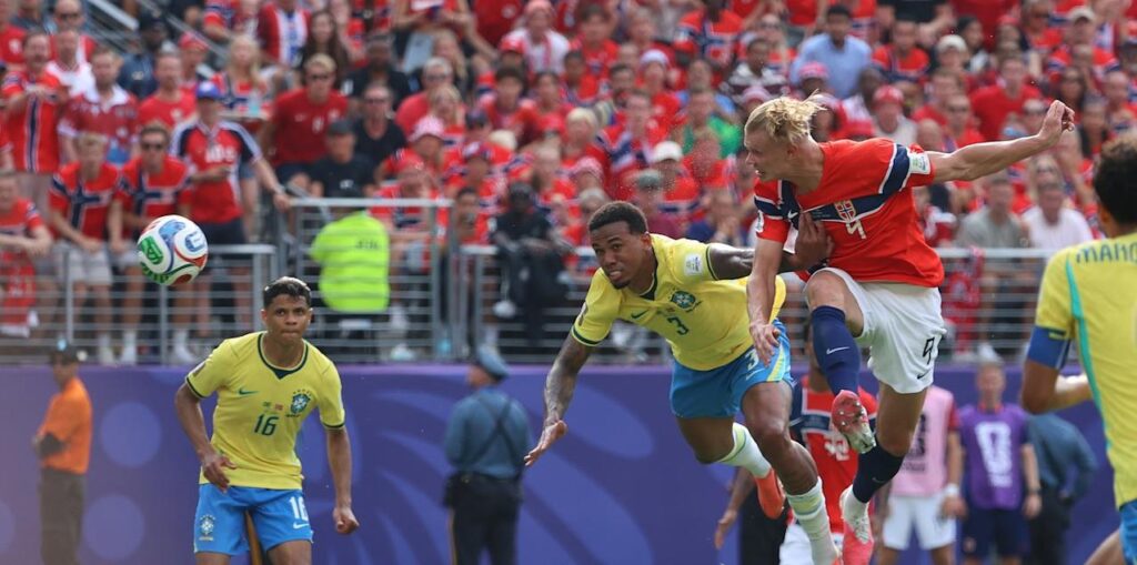 Erling Haaland scores a header against Brazil