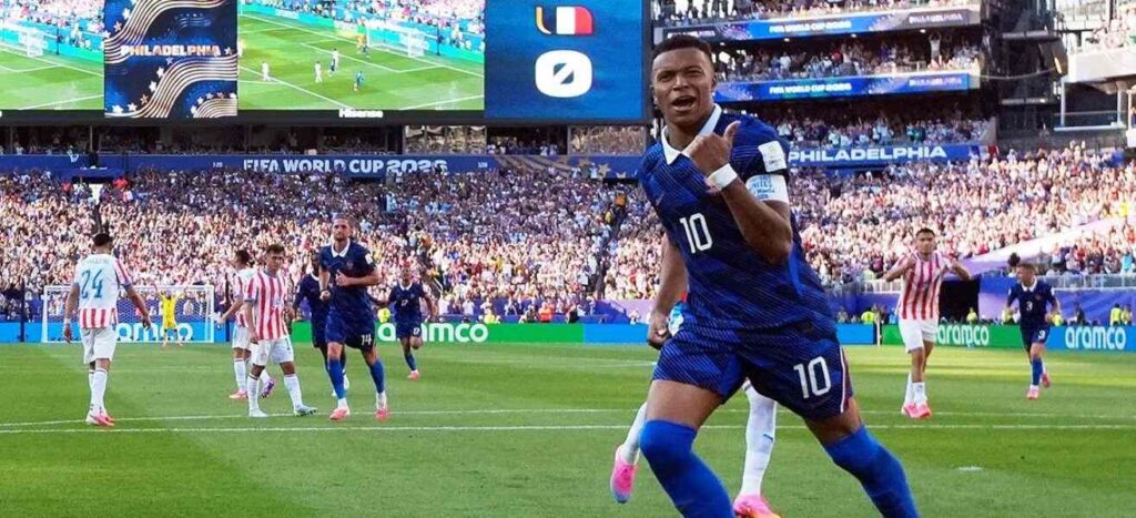 Kylian Mbappe celebrates after scoring a penalty against Paraguay