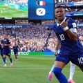Kylian Mbappe celebrates after scoring a penalty against Paraguay
