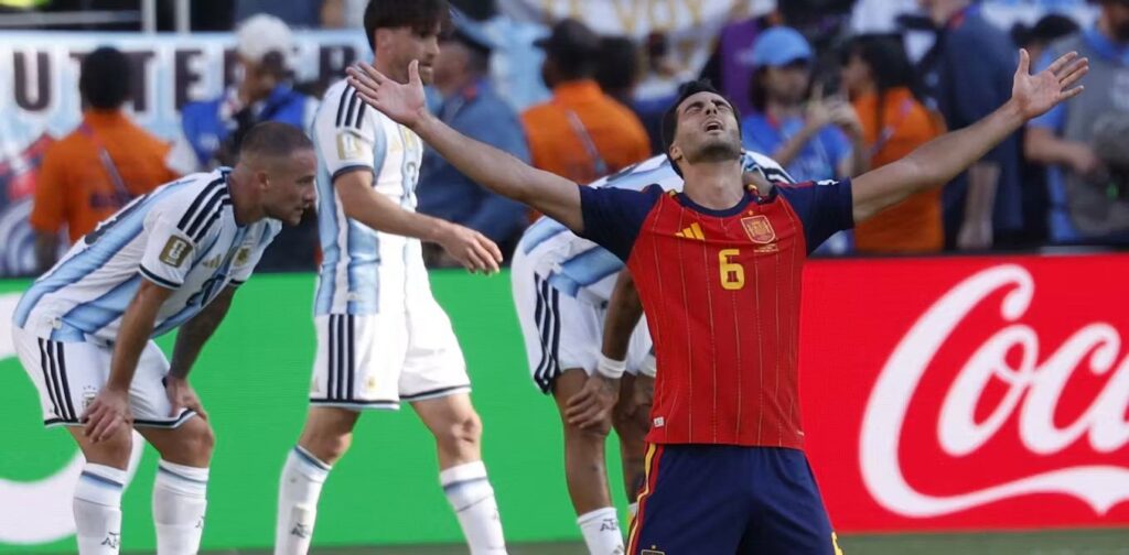 Mikel Merino celebrates Spain's goal against Argentina