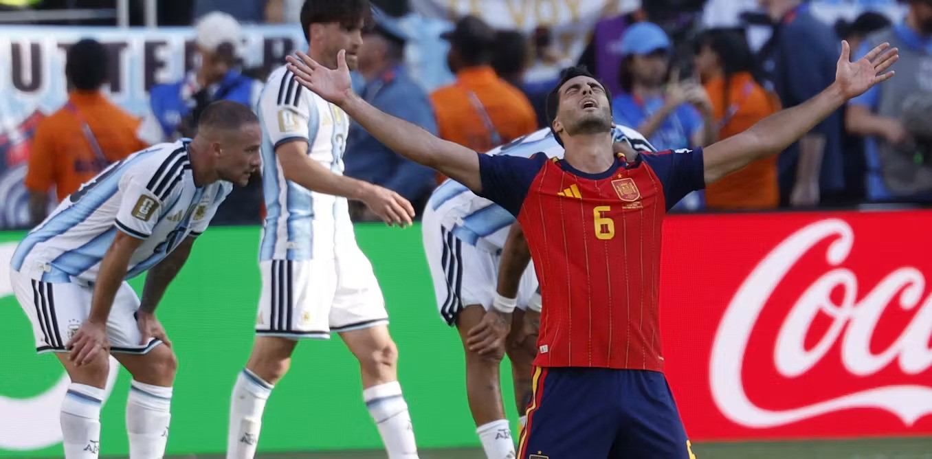 Mikel Merino celebrates Spain's goal against Argentina