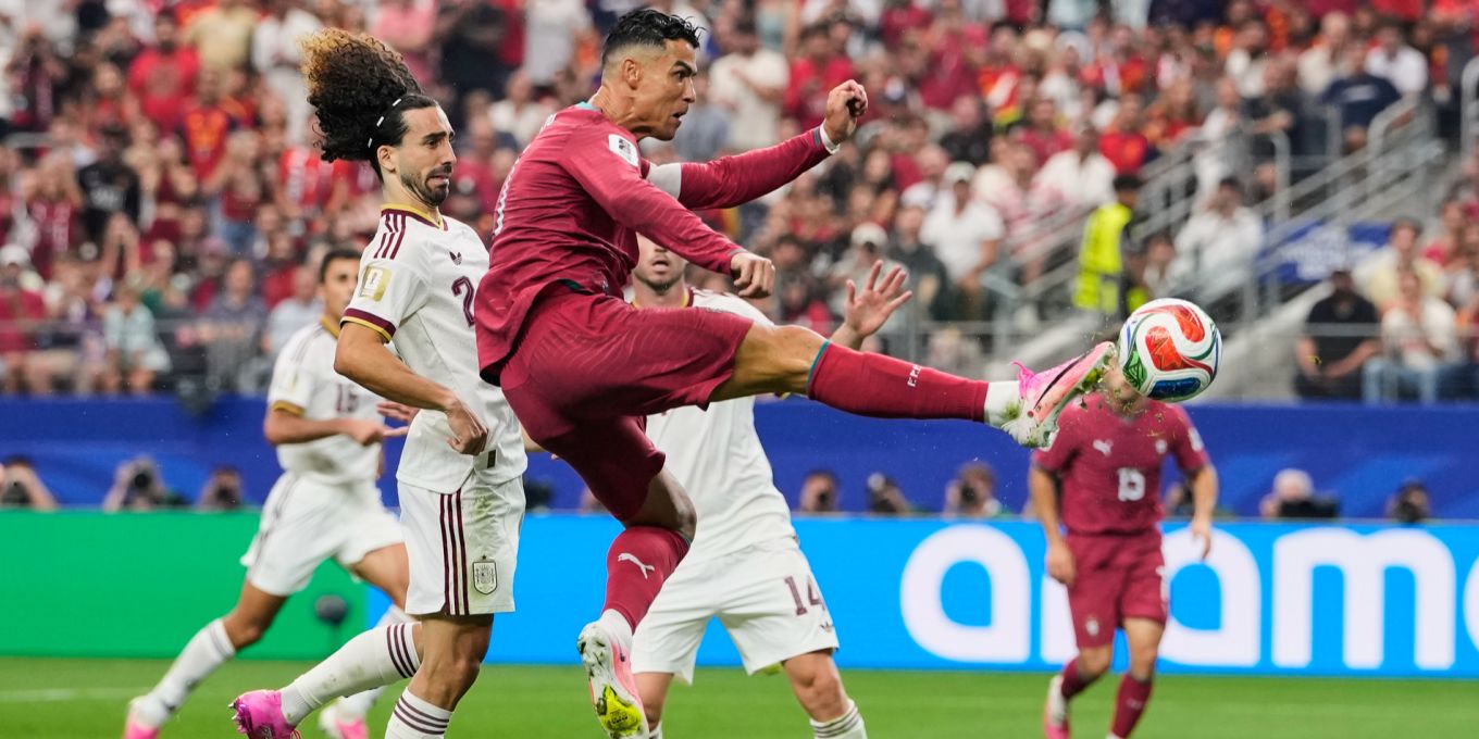 Marc Cucurella watches as Cristiano Ronaldo attempts a shot