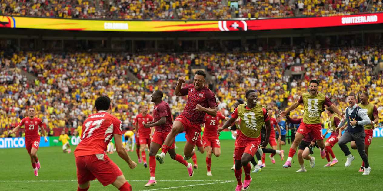 Switzerland players celebrate after winning penalty shootout against Colombia