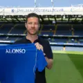 Xabi Alonso posing with Chelsea's shirt