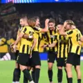 AEK players congratulate one another after scoring against Levski