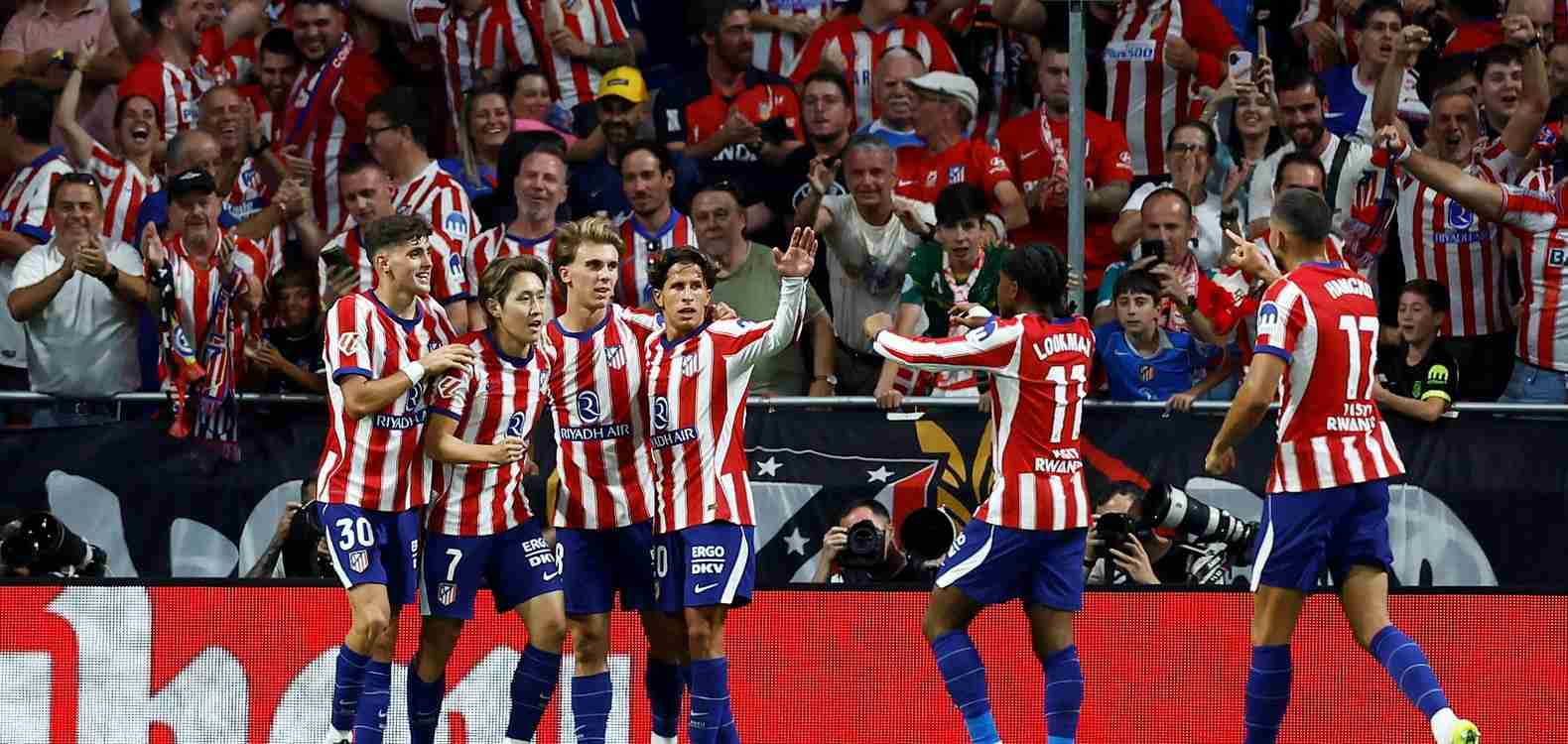 Atletico Madrid players celebrate after scoring against Malaga