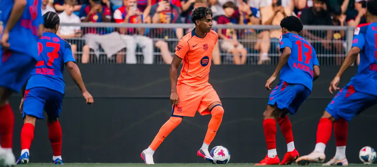 Lamine Yamal with the ball during the pre-season friendly between Basel and Barcelona
