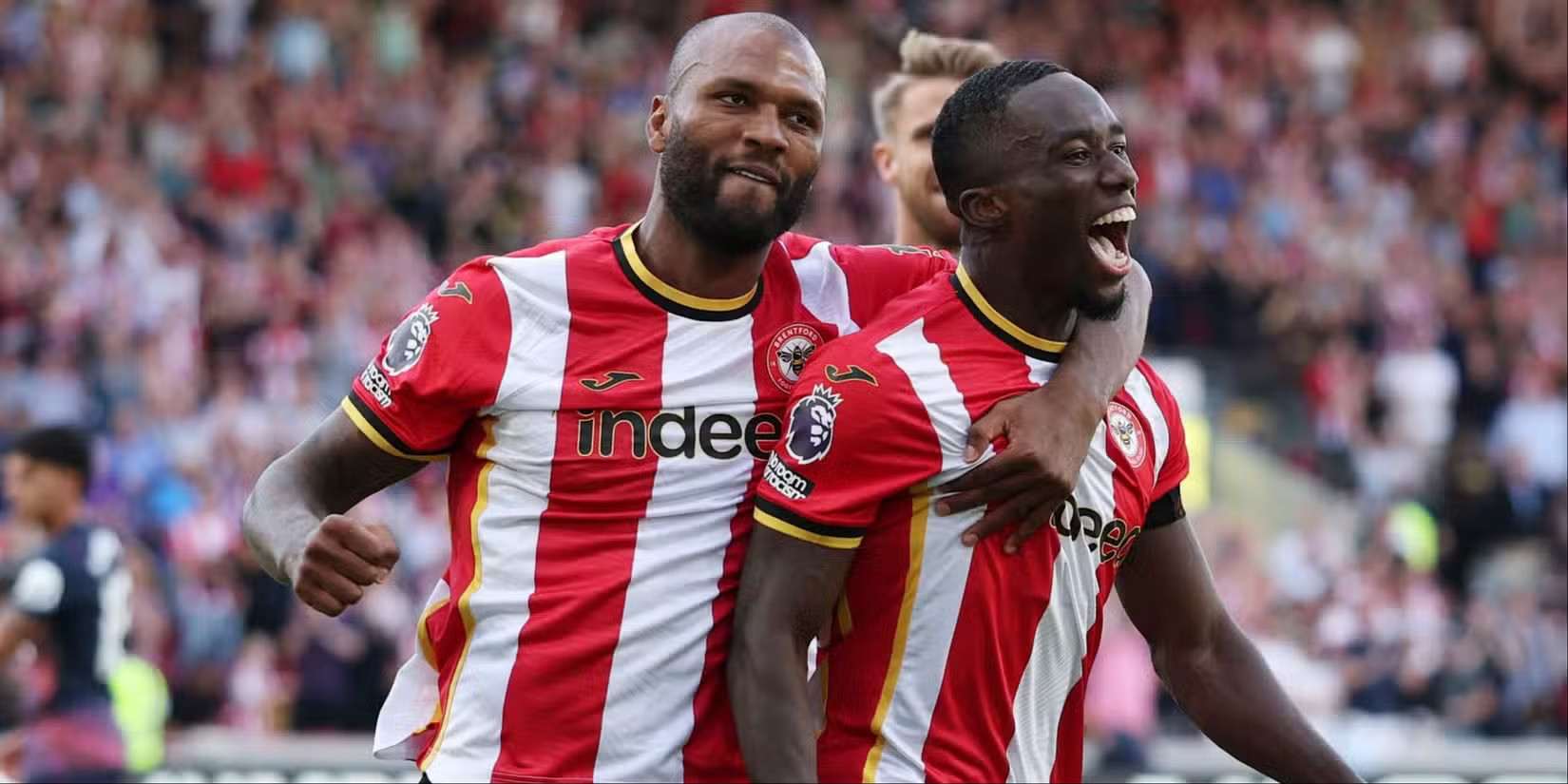 Brentford players celebrate after scoring against Tottenham