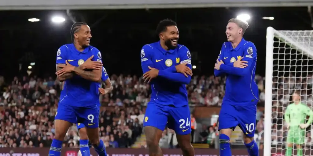 Chelsea players celebrate after scoring against Fulham