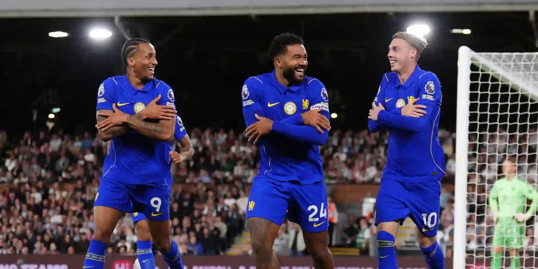 Chelsea players celebrate after scoring against Fulham
