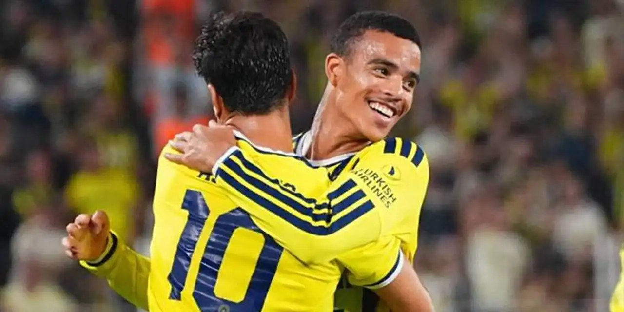 Mason Greenwood celebrates with Marco Asensio after scoring for Fenerbahce