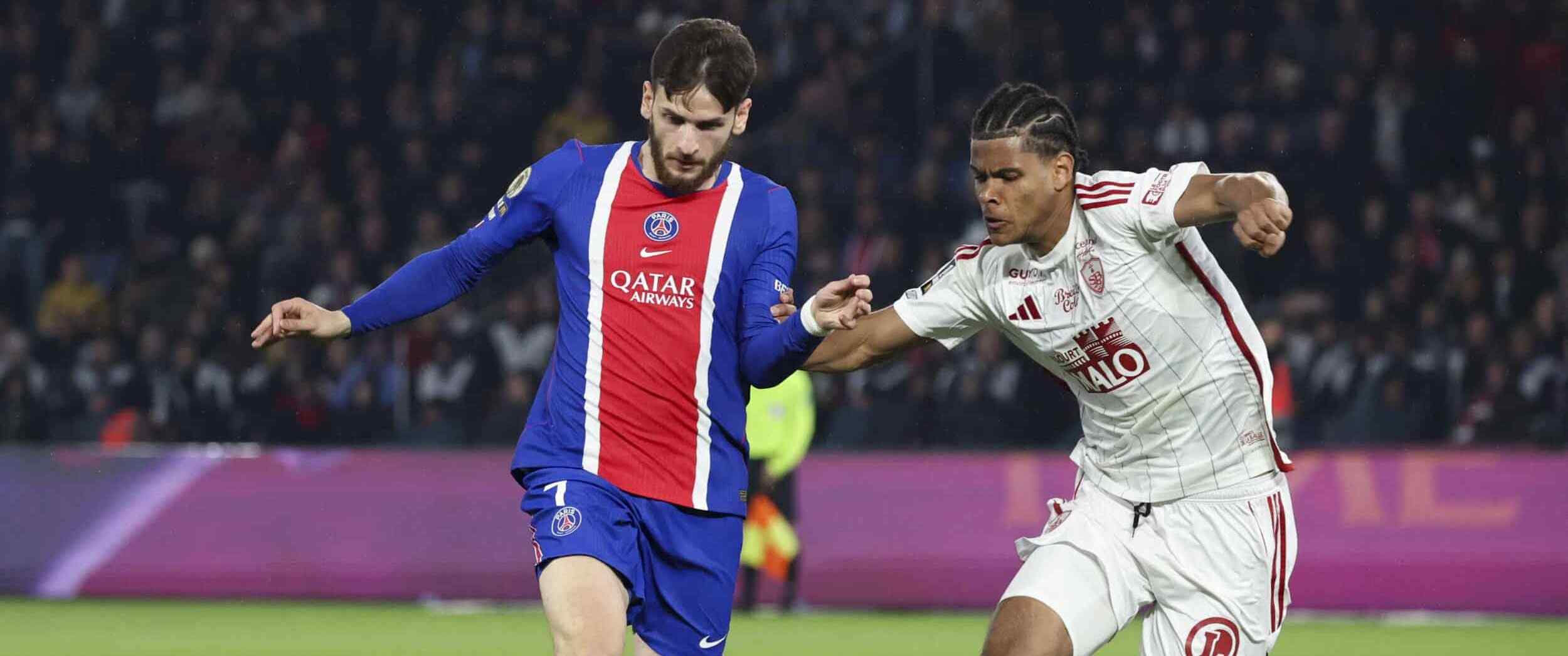 Khvicha Kvaratskhelia and Raphael Le Guen in a battle for the ball