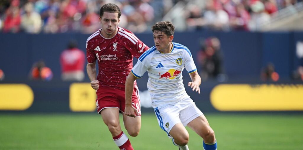 Liverpool and Leeds players in a battle for the ball during a friendly match