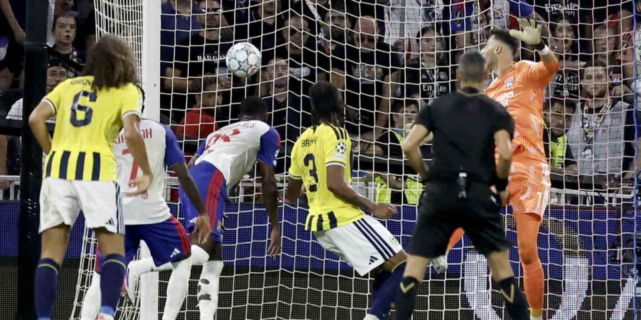 Lyon player heads the ball towards Fenerbahce's goal