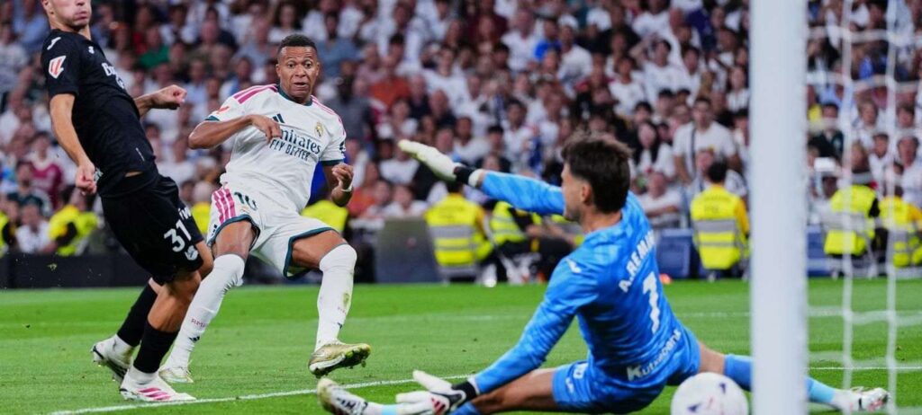 Kylian Mbappe shootin at Real Sociedad's goal