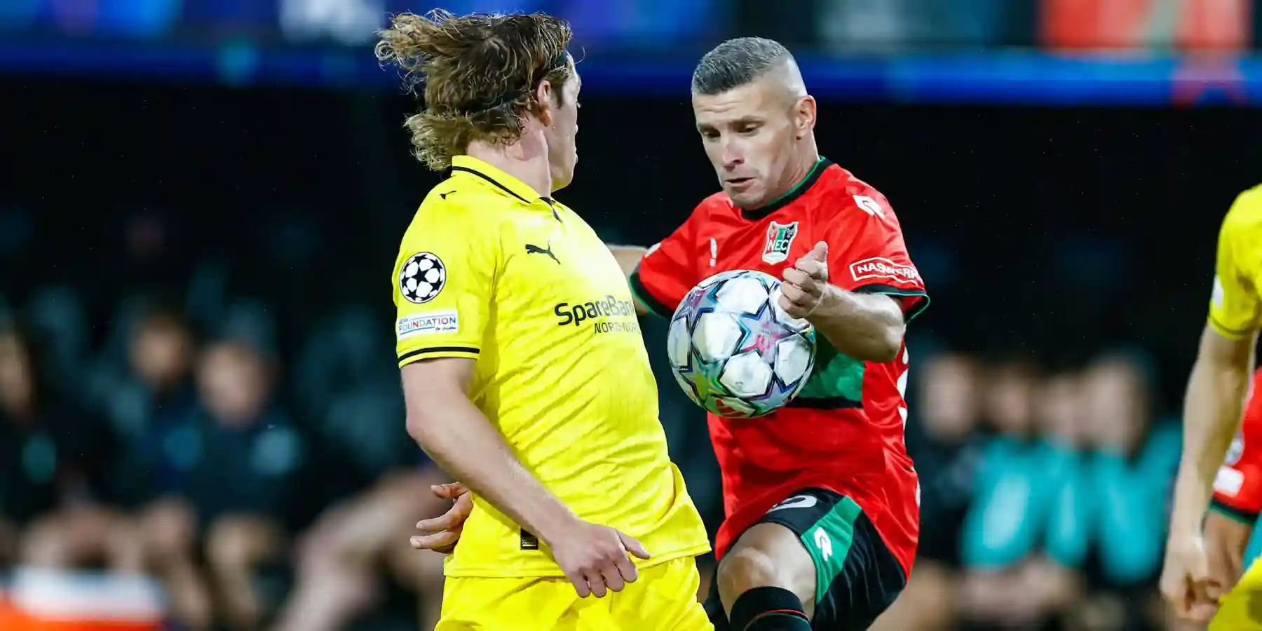 NEC and Bodo/Glimt players in a battle for the ball