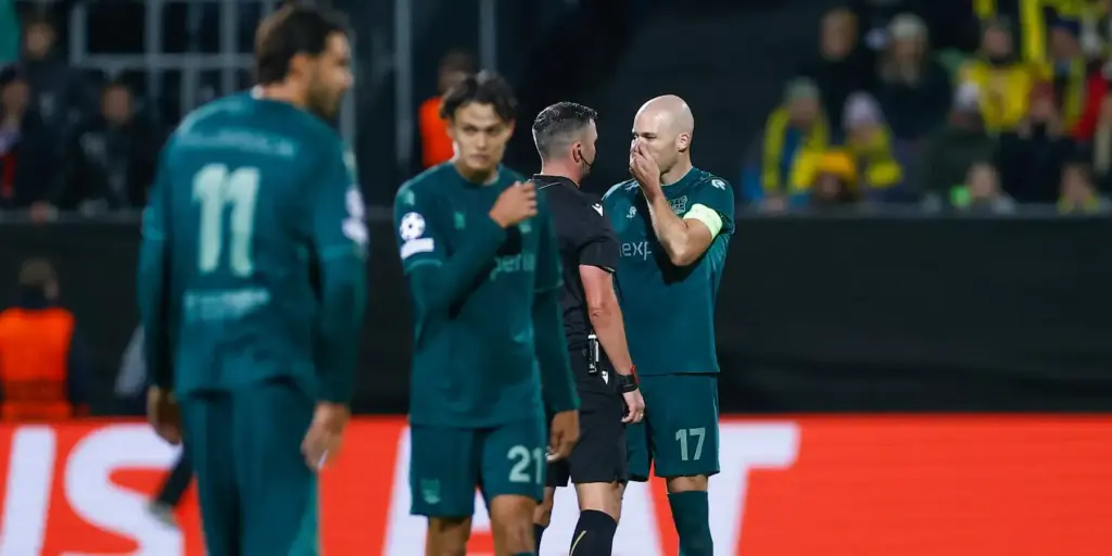 NEC Nijmegen players talking to the referee