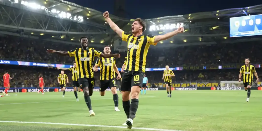 Razvan Marin celebrates after scoring for AEK against LASK