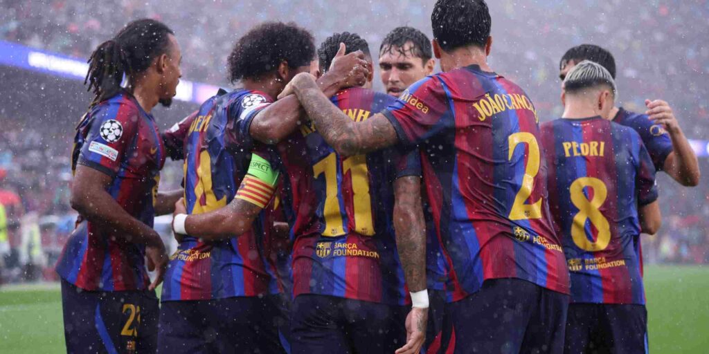 Barcelona players celebrate after scoring against Feyenoord