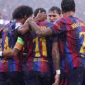 Barcelona players celebrate after scoring against Feyenoord
