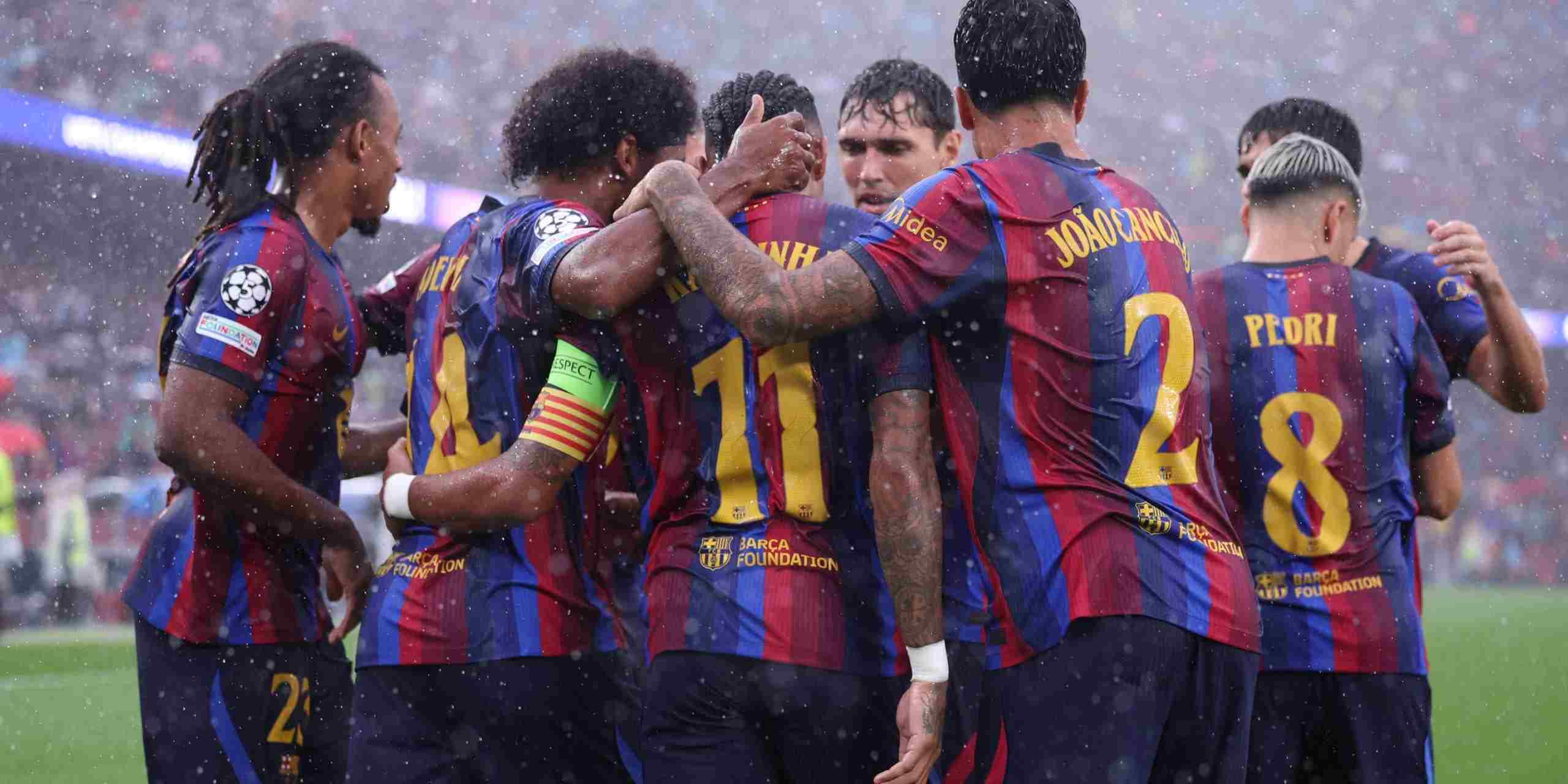 Barcelona players celebrate after scoring against Feyenoord