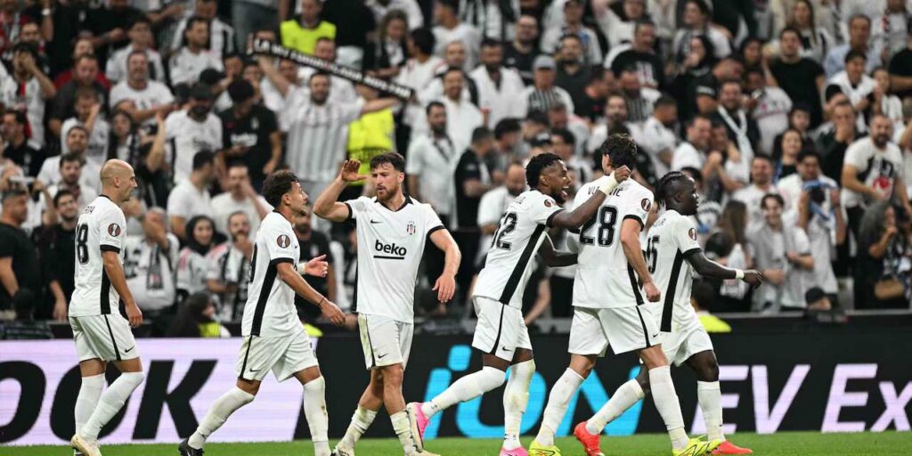 Besiktas players celebrate after scoring against Marseille