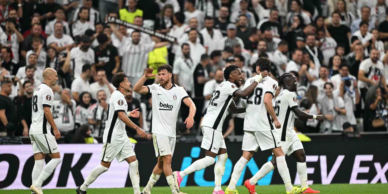 Besiktas players celebrate after scoring against Marseille