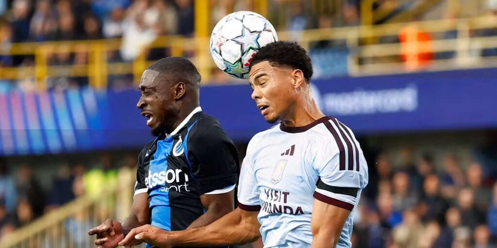 Club Brugge and Aston Villa players in a battle for a high ball