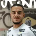 Phillipe Coutinho posing with Santos shirt