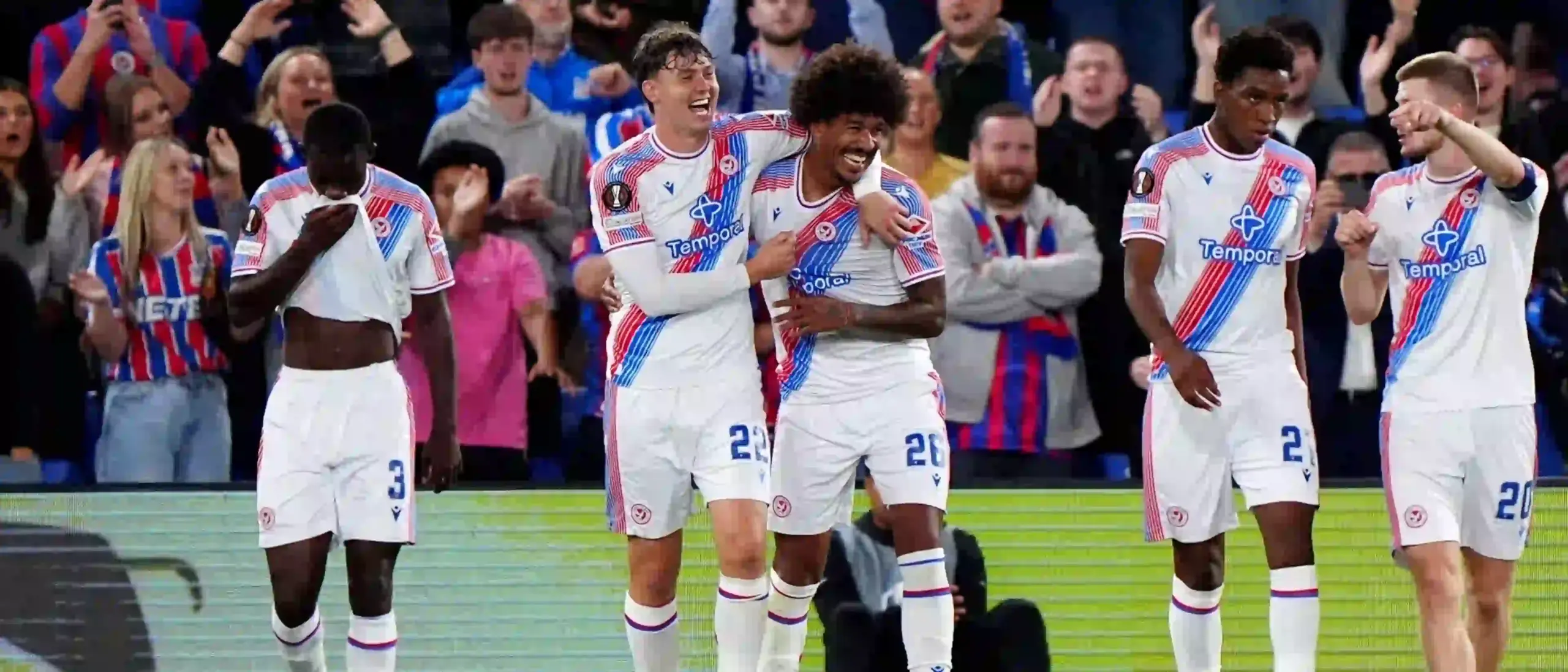 Crystal Palace players congratulate one another after scoring against Lech Poznan