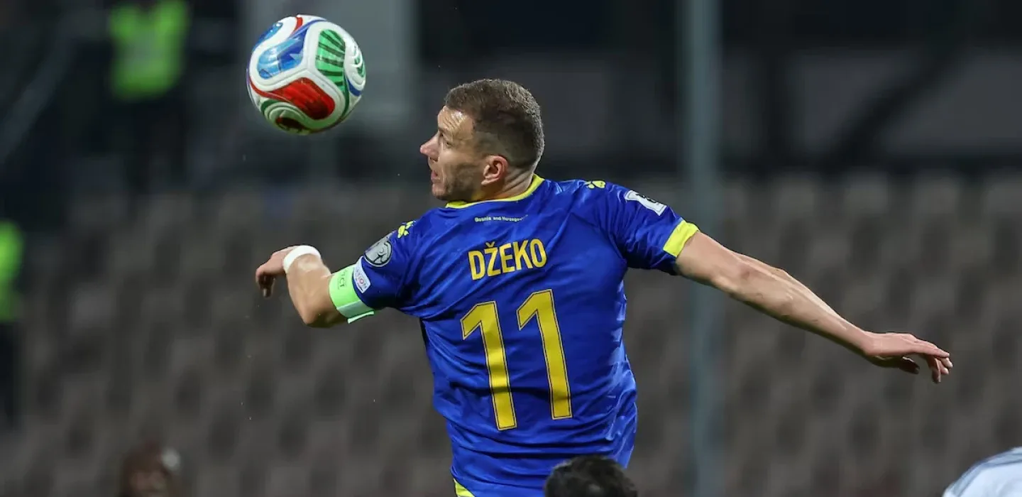 Edin Dzeko heading the ball